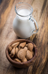 Jar of almond milk with almond nuts