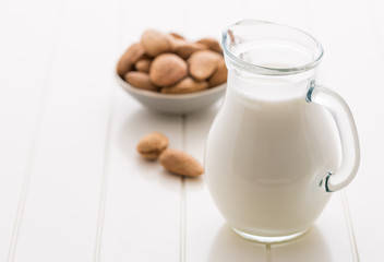 Jar of almond milk with almond nuts