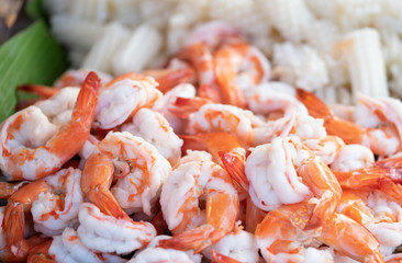 Pile of boiled peeled shrimps on market.