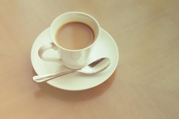 Coffee cup on wood table