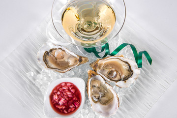 Opened Oysters with champagne and slices of lemon