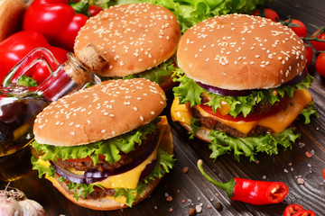 Hamburgers of the best products on a wooden background