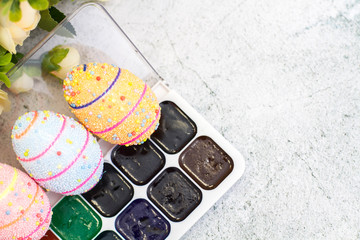 Easter eggs and watercolor closeup