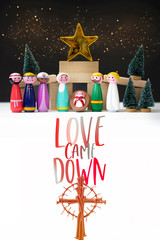 Love came down word and Nativity word .Christmas nativity scene of baby boy child Jesus Christ in the manger with Mary Joseph and three wise kings and star of bethlehem with Cross.