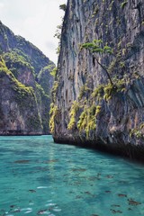 Island, Ocean views near Phuket Thailand with Blues, Turquoise and Greens oceans, mountains, boats, caves, trees resort island of phuket Thailand. Including Phi Phi, Ko Rang Yai, Ko Li Pe and other is