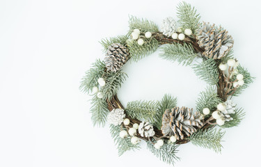 Fototapeta na wymiar Top view of Christmas round wreath made of natural with pinecones winter and Christmas concept.Flat lay background for text.