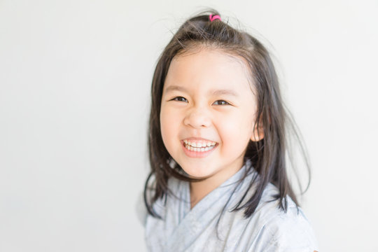 Little Asian Child Girl In Japanese Tradition Dress Ready For Onsen In Tokyo Japan.Happy Smiley Face 4 Years Japanese Kid Girl In Japan.