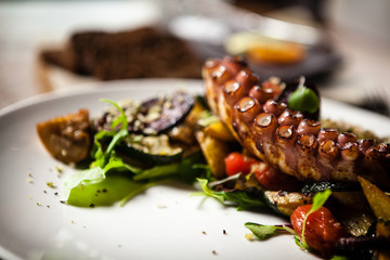 Octopus salad served on a plate in restaurant