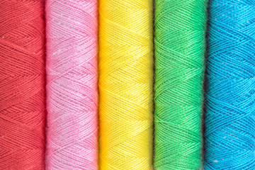 Close up selection of colourful sewing threads