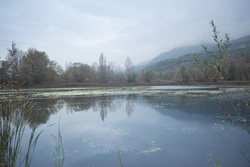 Fototapeta na wymiar Autumn panorama, bad wheater on lake