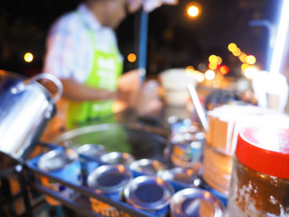 Blur image of cooking egg Roti over hot pan with palm oil in old style, cooking Roti in a black hot pan, Blurred background cooking Roti.