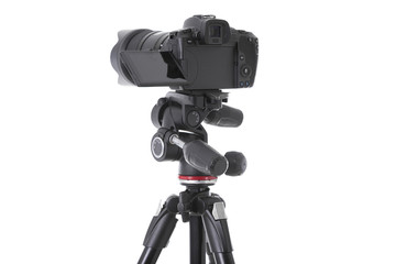 Backside view of modern multifunctional black camera on trepied isolated