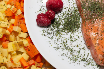 salmon dish with potatoes and carrots