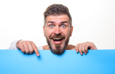 Bearded man with blank sign board. Smiling man with blank poster with space for text. Bearded man...