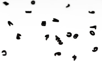 Sopa de letras y numeros negras sobre fondo de papel blanco