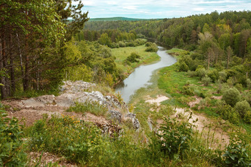 view of the river from the high mountains below the forest and a lot of green foliage