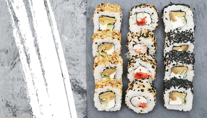 Japanese rolls on stone background.