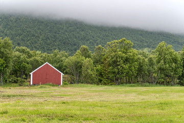 traditional warehouse at wood edge, near Hemmestad, Norway