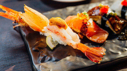 Premium Sushi Set include Deep fried Shrimp with Sea Urchin, Foie Gras, Salmon and Engawa on The...