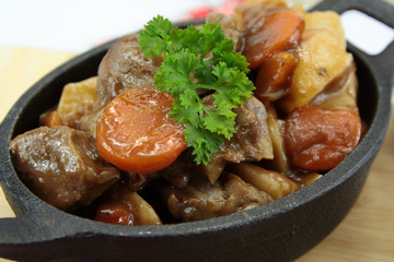 plate of beef bourguignon and potato