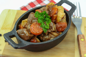 plate of beef bourguignon and potato