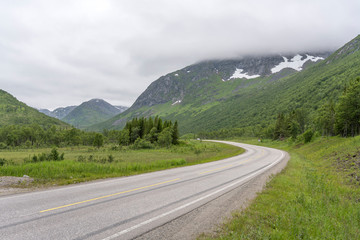 road bending in green landscape, near Lodingen, Norway