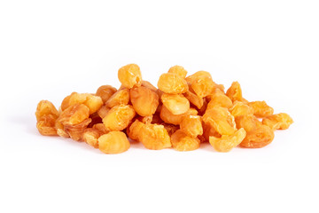 Golden dried longan fruit isolated on white background.