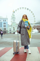 Fototapeta premium Woman holding a map in front of her