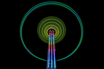 Long exposure of a carnival ride at night