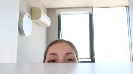 Woman looks for something in the closet, close-up