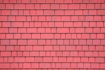 Background of old red wooden shingles. Texture wooden roof