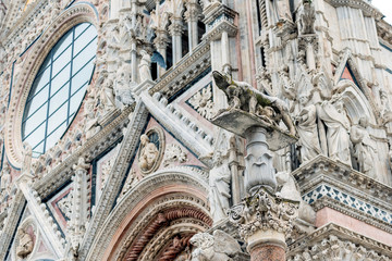 Naklejka premium Detail of facade of the cathedral of Siena with Sienese wolf