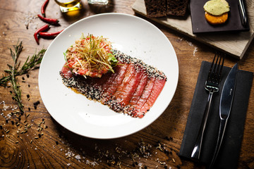 Tuna sashimi served on a plate in restaurant
