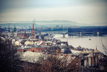 Bridges in Budapest over the Danube River and a building on the waterfront.