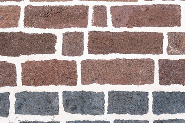 old brick wall background with white grout in joints