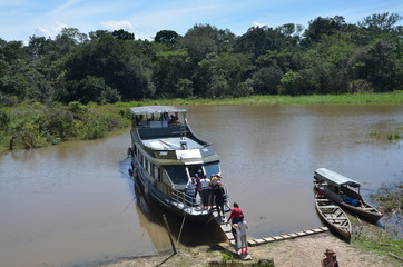 Typical wooden boats for transportation in the Amazon River Colombia