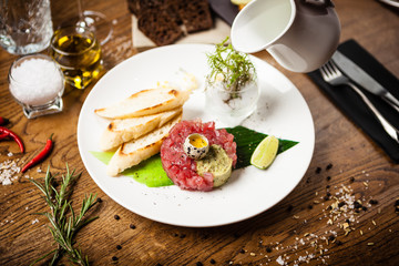Tuna tartare served on a plate in restaurant