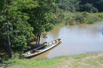 Typical wooden boats for transportation in the Amazon River Colombia