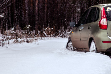 a car makes its way through fresh snow