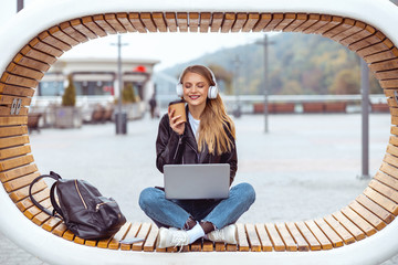 Smiling pretty freelancer napping on the bench