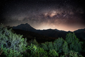 Obraz na płótnie Canvas Milky way galaxy setting over the coastal mountains, specifically La Campana in Central Chile. 
