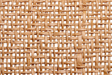 Wicker twigs texture isolated. Close-up of a detail of a handmade wicker lamp shade isolated on a...