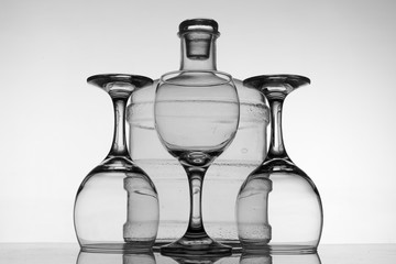 Surreal, three glasses and small carboy