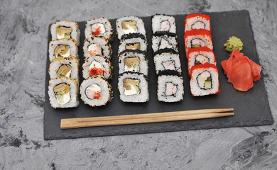 Japanese rolls on stone background.