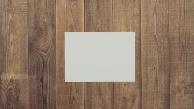 Animation of tools on wooden table for brand logo on white sheet. Theme stop motion hand tools for logo intro. Concept of brand promotion for the provision of repair services, locksmith or woodworker.