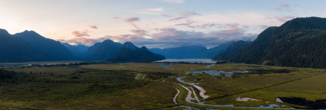 Beautiful Aerial Panoramic View of Canadian Mountain Landscape during a vibrant summer sunset. Taken near Pitt Lake, Near Vancouver, British Columbia, Canada. © edb3_16