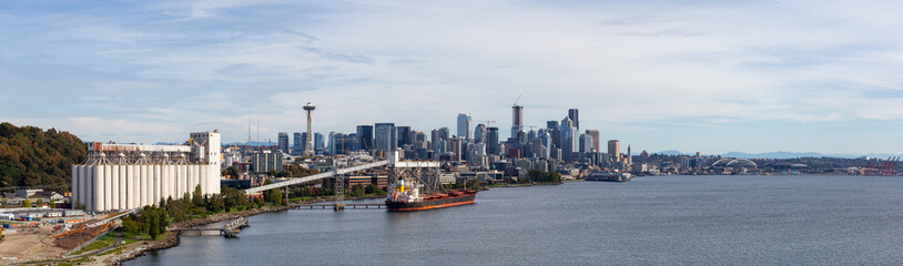 Downtown Seattle, Washington, United States of America. Aerial Panoramic View of the Modern City on the Pacific Ocean Coast during a sunny and cloudy Autumn Day.