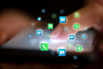 Finger touching phone with friends and contact concept and dark background