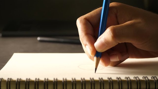 Hand drawing a flat line with a black pencil