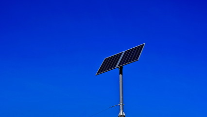 Obraz premium Solar panel on a background of blue sky